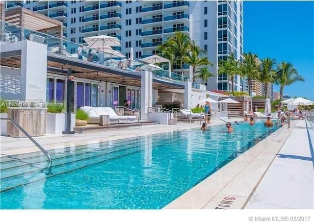 pool with a patio area