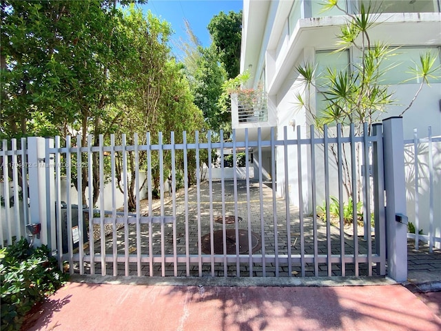 view of gate with fence