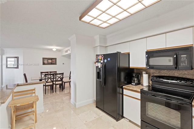 3530 Mystic Pointe Dr Unit 1508, Aventura, FL 33180 - kitchen featuring white cabinetry, marble finish floor, black appliances, tasteful backsplash, and crown molding