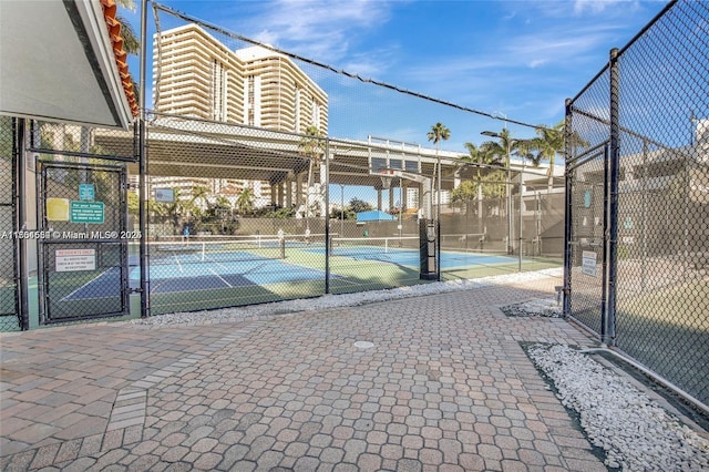 3530 Mystic Pointe Dr Unit 1508, Aventura, FL 33180 - exterior space with a tennis court, a gate, and fence