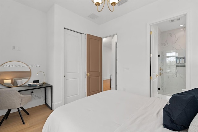 bedroom featuring connected bathroom, visible vents, baseboards, a closet, and light wood-type flooring