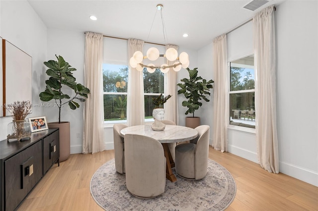 dining area with a chandelier, recessed lighting, visible vents, and light wood-style flooring