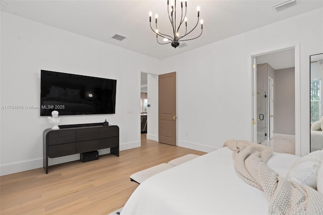 bedroom with visible vents, light wood-style flooring, and baseboards