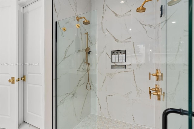 full bathroom with a marble finish shower