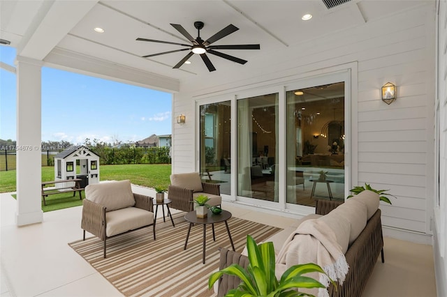 view of patio with ceiling fan and an outdoor hangout area