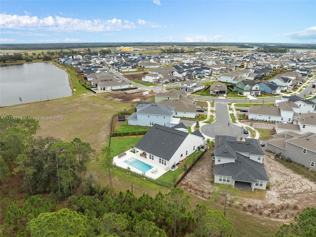 aerial view with a water view and a residential view