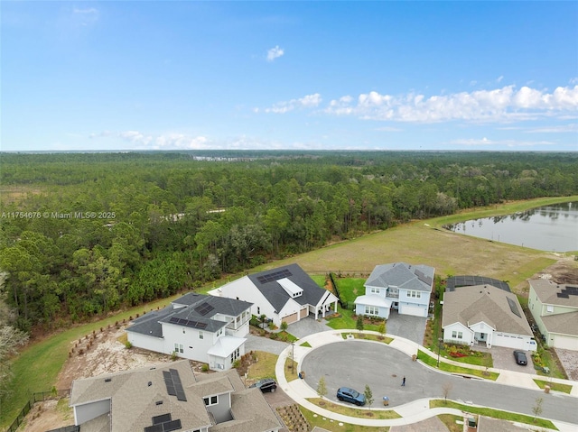 aerial view featuring a water view, a residential view, and a view of trees