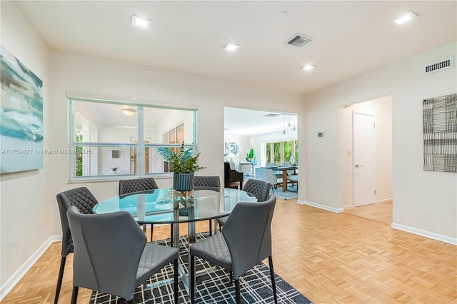 dining room featuring visible vents and baseboards