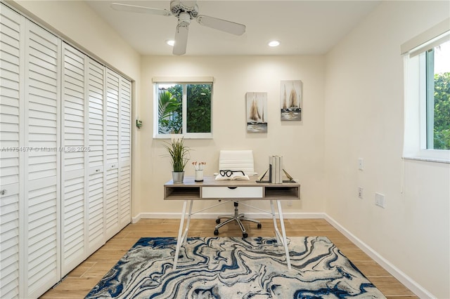 office area featuring recessed lighting, baseboards, light wood-style floors, and ceiling fan