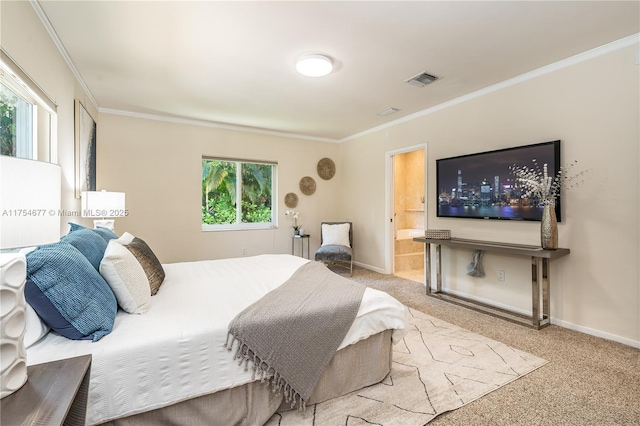 carpeted bedroom with ornamental molding, visible vents, connected bathroom, and baseboards