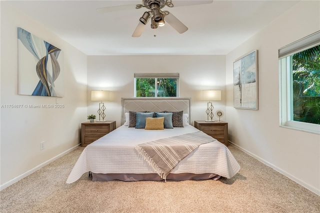 bedroom with ceiling fan, baseboards, and carpet