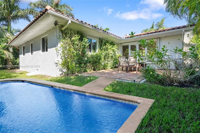 pool with a patio area