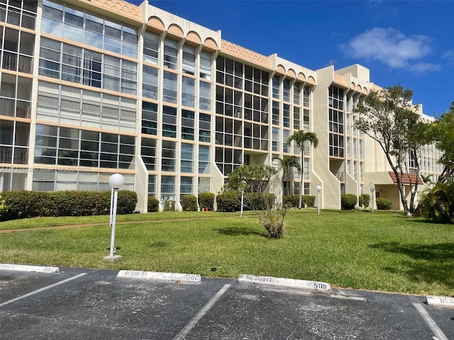 851 Three Islands Blvd Unit 218, Hallandale Beach, FL 33009 - view of apartment building / complex featuring uncovered parking