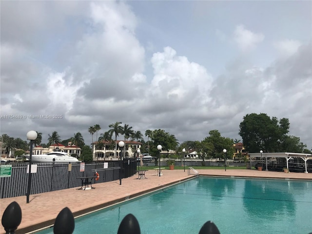 community pool featuring fence