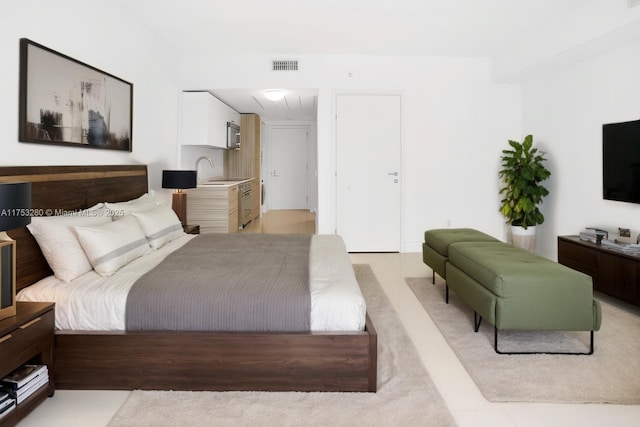 bedroom featuring a sink and visible vents