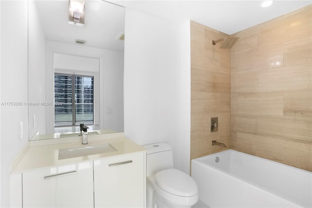 full bathroom featuring visible vents, shower / bath combination, vanity, and toilet