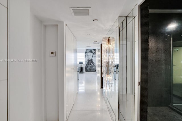 corridor featuring tile patterned flooring and visible vents