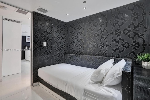 bedroom featuring visible vents, tile walls, and recessed lighting