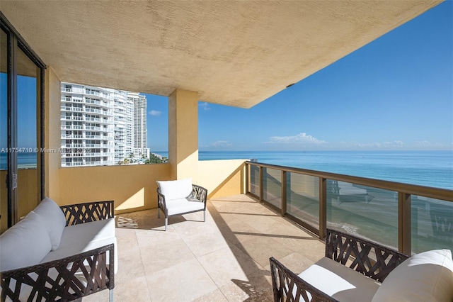 balcony featuring a water view