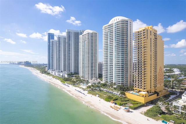 aerial view featuring a view of city, a water view, and a view of the beach