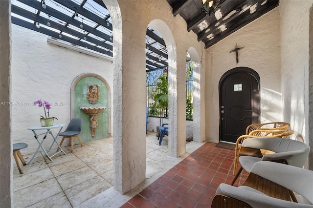 doorway to property featuring a patio area