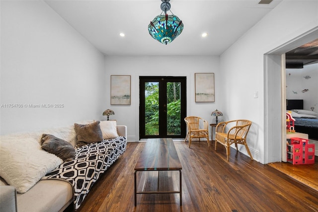 living area with recessed lighting, french doors, baseboards, and hardwood / wood-style floors