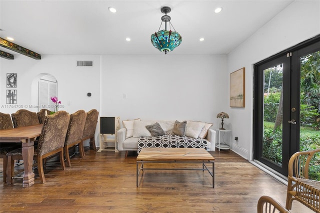 living area with baseboards, visible vents, wood finished floors, french doors, and recessed lighting