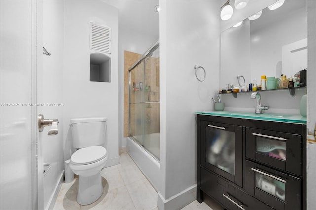 full bathroom featuring baseboards, vanity, toilet, and shower / bath combination with glass door