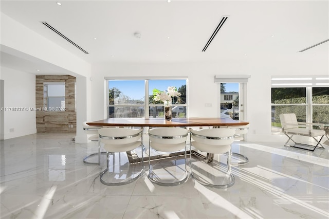 dining area with marble finish floor