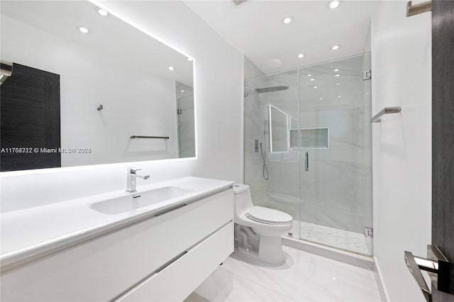 bathroom featuring toilet, a stall shower, recessed lighting, and vanity