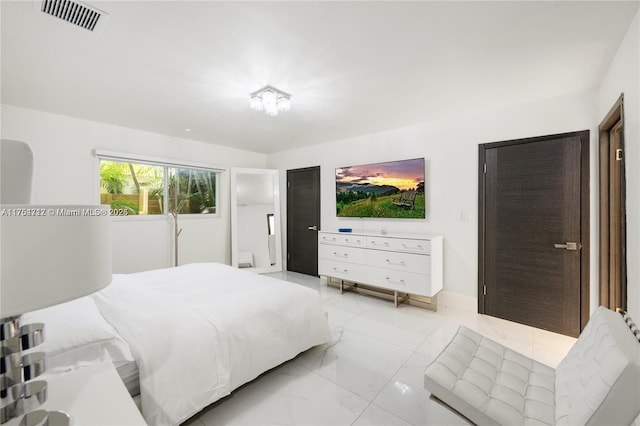 bedroom with marble finish floor and visible vents