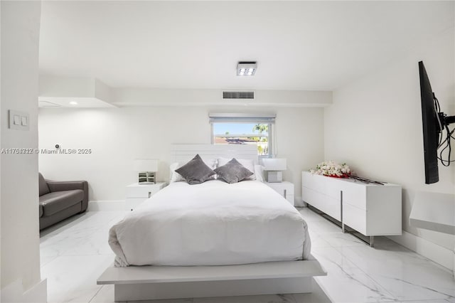 bedroom featuring marble finish floor, visible vents, and baseboards