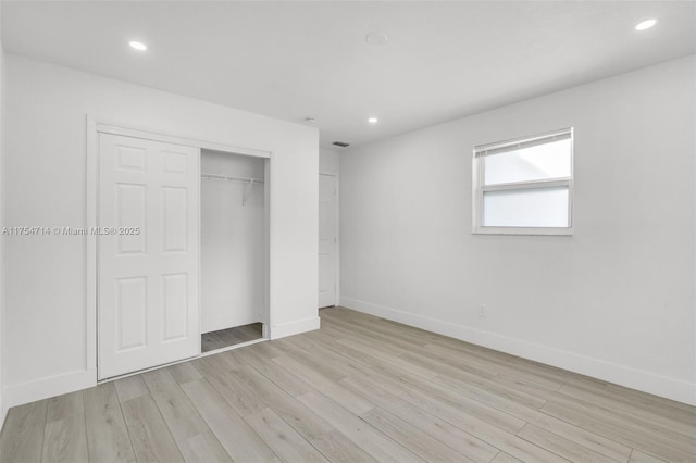 unfurnished bedroom with recessed lighting, baseboards, and light wood finished floors