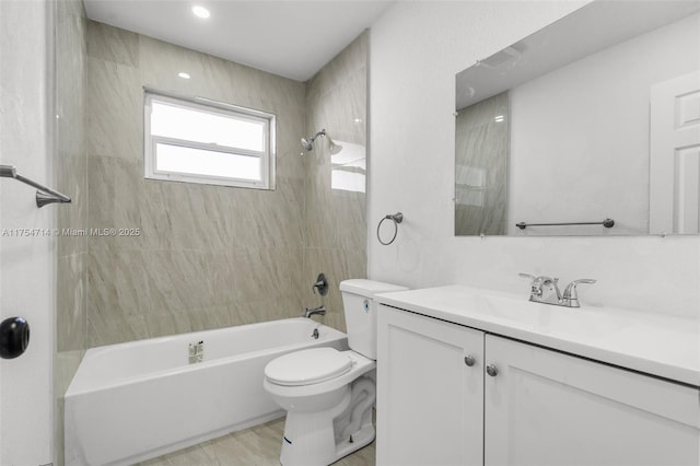 bathroom with toilet, bathtub / shower combination, and vanity