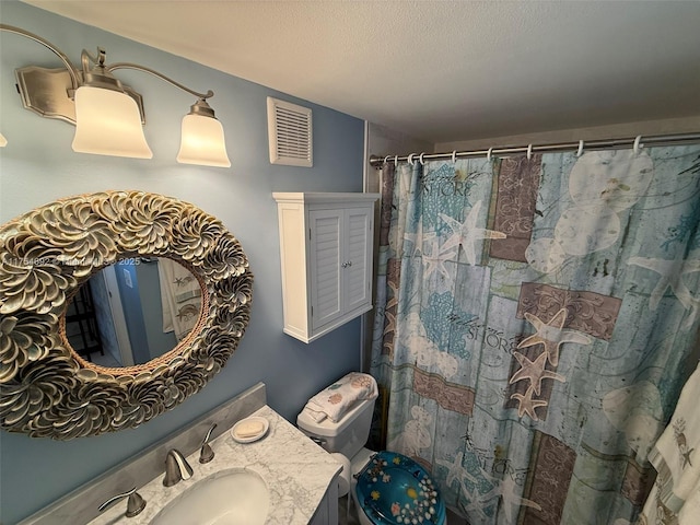 full bathroom with visible vents, toilet, a shower with curtain, a textured ceiling, and vanity