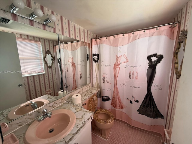 full bathroom with toilet, tile patterned floors, vanity, a shower with curtain, and wallpapered walls