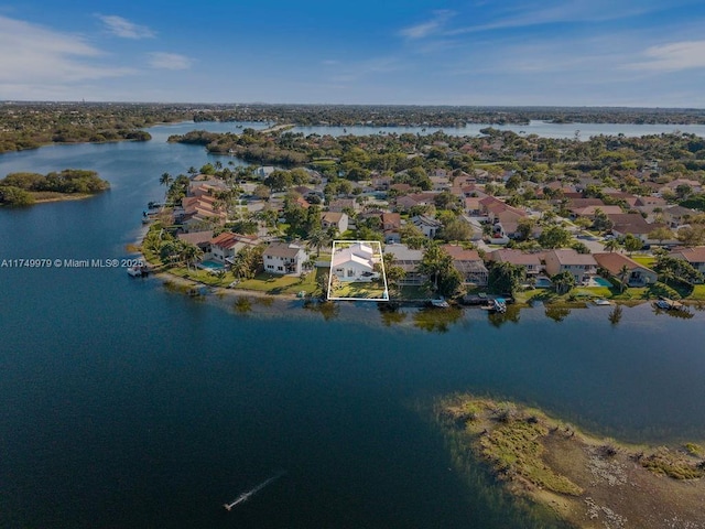 bird's eye view featuring a water view and a residential view