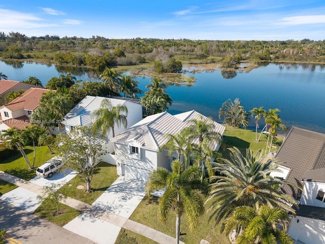 birds eye view of property with a water view