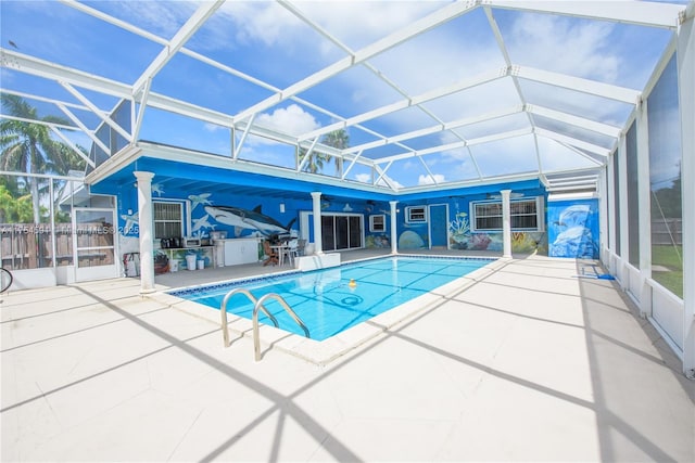 outdoor pool with a lanai and a patio