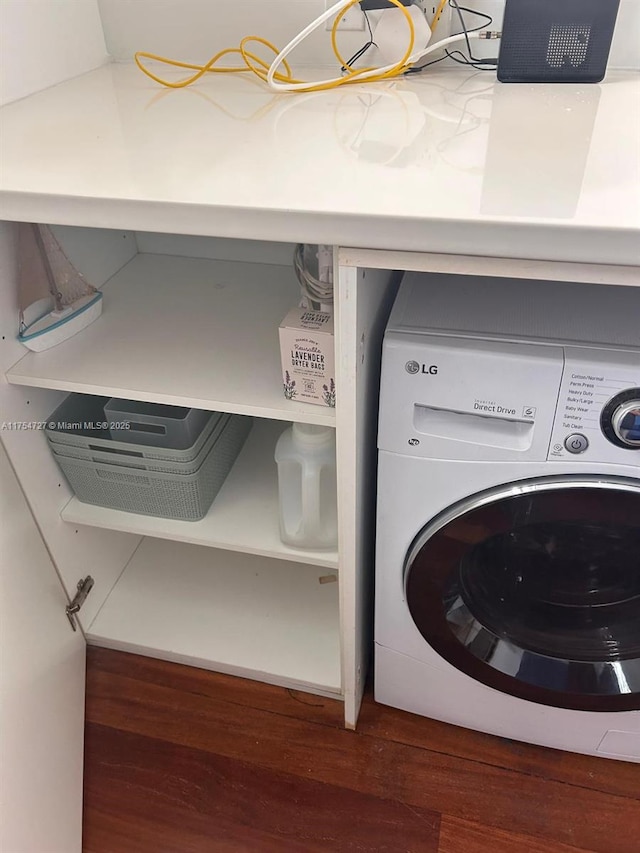 washroom featuring wood finished floors, washer / clothes dryer, and laundry area