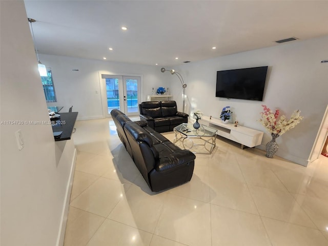 living room with recessed lighting, french doors, visible vents, and tile patterned floors