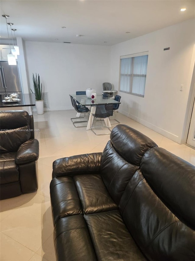 living area featuring recessed lighting and tile patterned floors