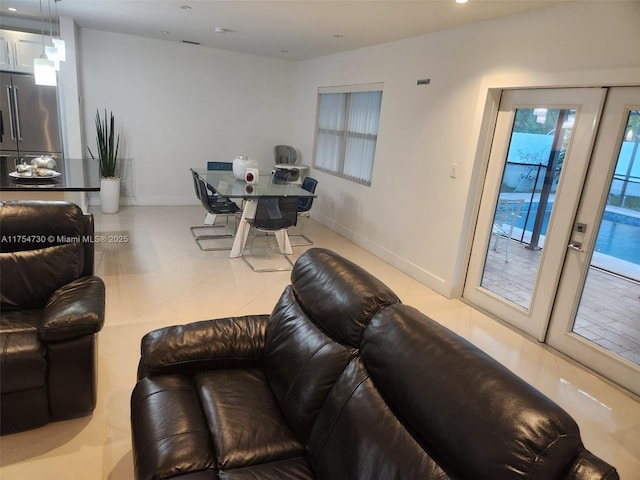 living area with recessed lighting and baseboards