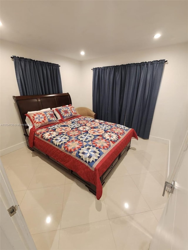 bedroom with recessed lighting, tile patterned flooring, and baseboards