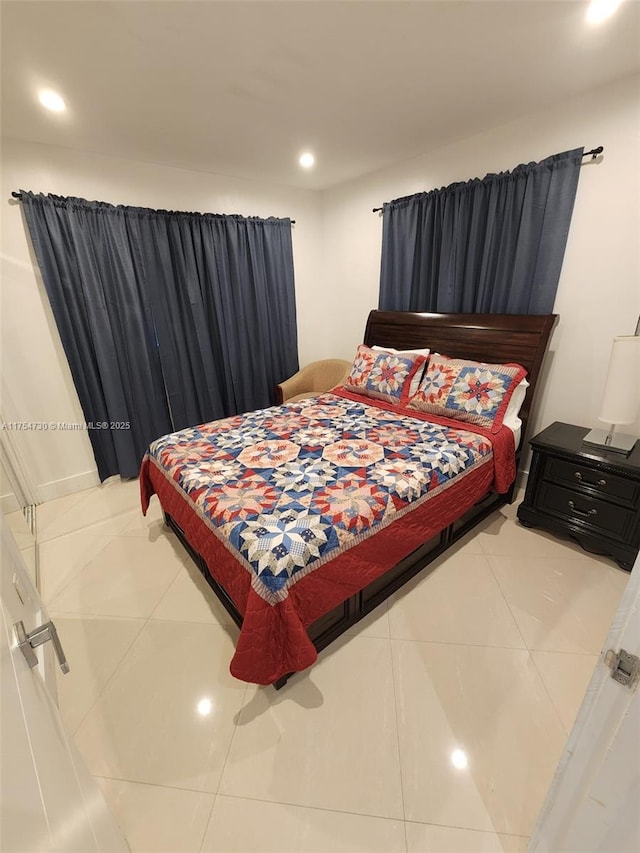 bedroom with recessed lighting and tile patterned floors