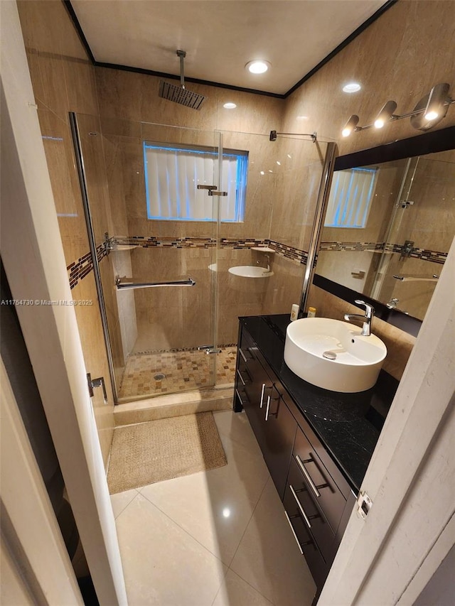 full bathroom featuring a shower stall, vanity, and tile patterned floors