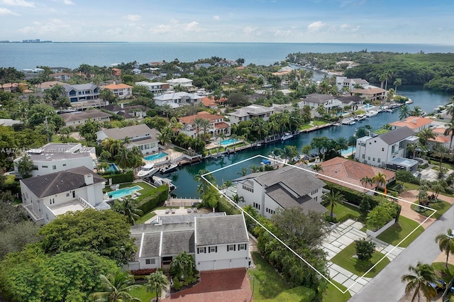 aerial view featuring a residential view and a water view