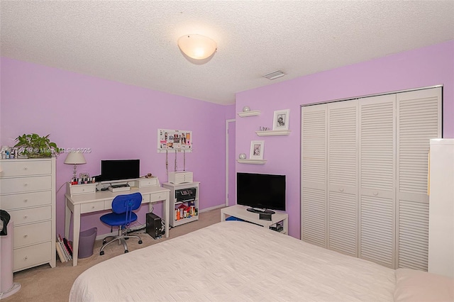 2518 NE 206th Ter, Miami, FL 33180 - carpeted bedroom with a closet, a textured ceiling, and visible vents