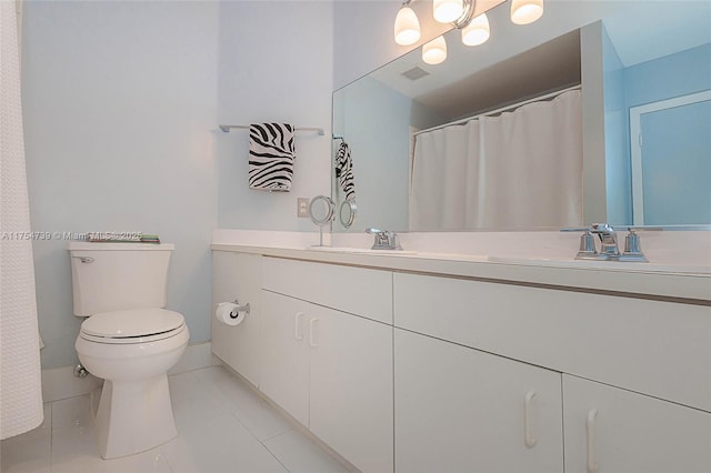bathroom featuring vanity, tile patterned flooring, visible vents, and toilet