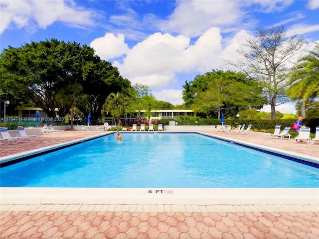 pool featuring a patio area and fence